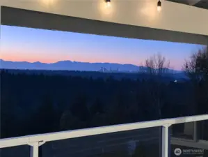 Twilight shot of the mountains and the sparkle of Down Town Seattle in the distance.