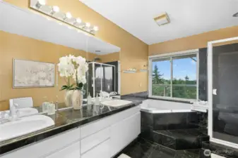 5 Piece Primary Bath with soaking tub, dual vanity, separate bidet and toilet (not shown, but can be seen in reflection of shower door)