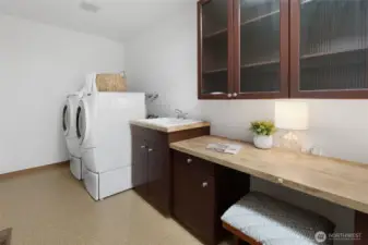 Large Laundry room with built in desk - great place for sewing crafting (or hiding away!)  - Not shown: additional shelving  & Whole house vacuum accessories