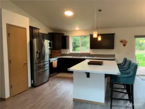 Spacious Kitchen with stainless steel appliances.