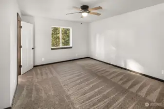 un-virtually staged photo of primary bedroom