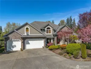 Welcome to Edgewood Estate, nestled on 1.3 acres of land. This residence offers ample space and privacy, situated at the end of a peaceful cul-de-sac. The three-car garage provides parking and storage. Recent updates include a central vacuum system and an updated air-conditioning unit.