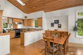 The kitchen features TWO eating bars and is open to dining spaces.