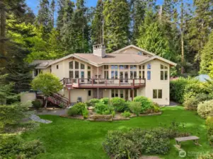 Custom home with stunning landscaped grounds.
