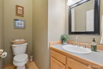 The main floor powder room, which is conveniently located between Living Rooms, Dining Rooms, Family Room and kitchen areas.