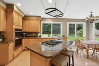 The kitchen and living spaces feature granite countertops and hardwood floors.