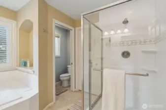 Shower, private toilet room and walk-in closet in primary bathroom