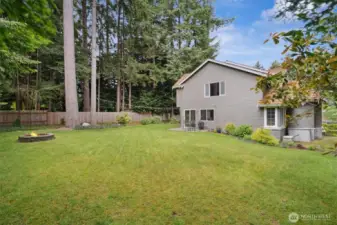 Enjoy the fire pit and the level yard is perfect for lawn games.