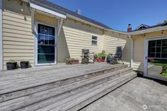 Your south side sunny deck with access to the paved driveway and 2 car garage