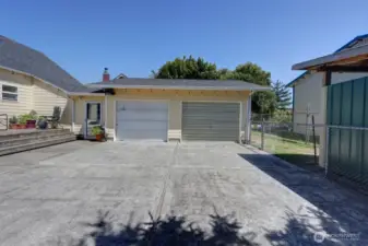 Access to the paved driveway and 2 car garage with a fully fenced back yard