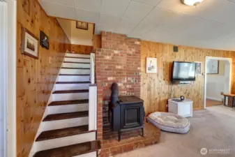 Straight ahead to the 2 upstairs bedrooms. Primary bedroom to the left and living room to the right.