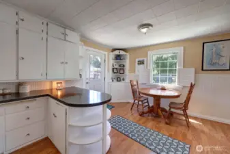 From the kitchen looking towards the dining room and door to the back deck