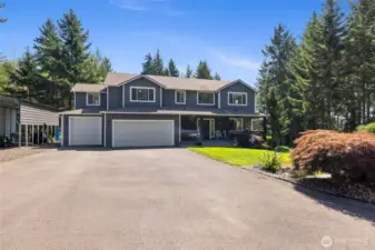 Welcome Home! You could play basketball with all this driveway.