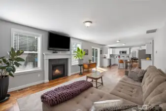 Great room with inset carpet in the wood floor