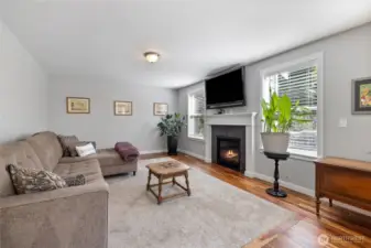 Cozy with gas fireplace and lots of windows to the backyard