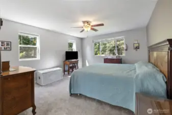 Primary bedroom is full of natural light