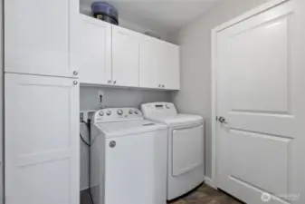 Laundry room w/storage leads to 3 car garage