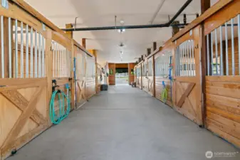 Barn offers 6 stalls, heated tack room and wash area