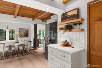 The stunning kitchen offers abundant cabinetry and generous counter space.