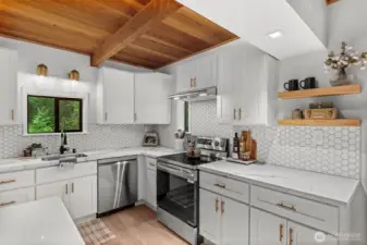 Beautiful new lighting and thoughtful design create the perfect kitchen space.