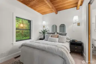 The main-level bedroom creates flexibility for guests, office, or hobbies.