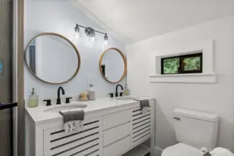 Double sinks make the primary bath functional and luxurious.