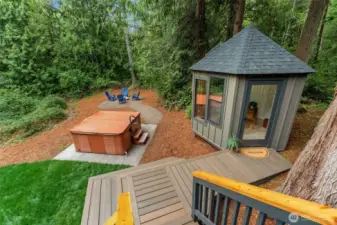 Outdoor living at its best: hot tub, fire pit, and the greenest lawn await.