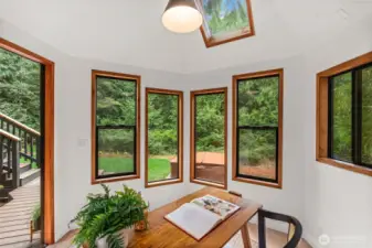Freshly updated with paint, lighting, and flooring, this space is full of charm.