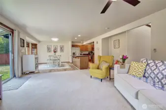 Bright and airy open floorplan connecting the kitchen, dining, and family areas, perfect for entertaining or everyday life. New LVP flooring, new carpet, and all-new lighting create a fresh, welcoming atmosphere.