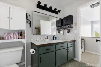 An updated bathroom is shared between the primary bedroom and second bedroom.