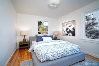 The larger of the 2 bedrooms on the main floor facing NW