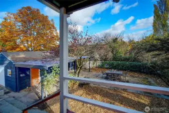 View from backporch towards the large, detached garage. Imagine your home office or yoga studio across that yard!