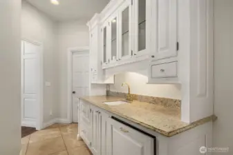 Large serving counter with2 warming drawers, Asko Dishwasher, walk in pantry, and in-ground wine cellar with up to 1000 bottle capacity