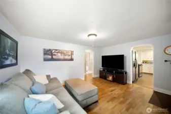 Living room with view toward kitchen.