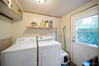 Laundry room with exterior access.