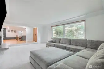 Spacious living room opens up to brand-new gourmet chef’s kitchen w/ premium finishes, quartz counters, huge island.