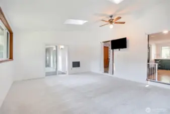 Bonus /Media room features an open, light-filled layout with neutral finishes.