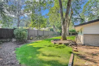 Private backyard that feels like a park perfect for relaxing or entertaining.