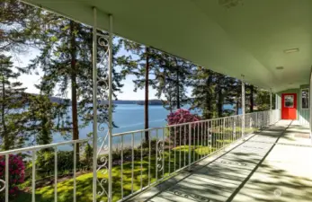 The main floor covered deck spans the length of the home; the perfect place for maritime wildlife viewing.