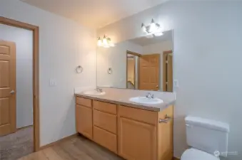 Ample counter space for two in the primary ensuite.