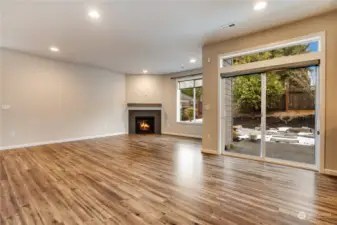 Central gas fireplace. This space is very private with backyard trees providing great shade during the summer and privacy throughout the year.