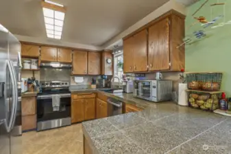 Chef's kitchen with lots of cupboard and counter space.