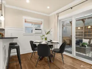 A full-size dining table easily fits. Most not-so-big homes can barely fit a bistro table if any table. This home has room for a full-size table!