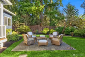 The grassy side yard is the perfect place to play and relax.