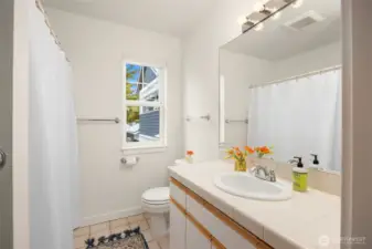 The full bath of the ADU includes a large storage space.