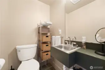 Primary bedroom’s half bath.