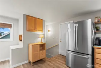 Stairs to lower level off of the kitchen.