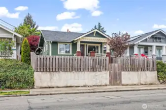 View from across the street - fully fenced with tall privacy fencing in the front yard.