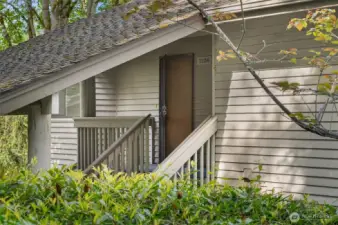 Front door from green space just outside unit