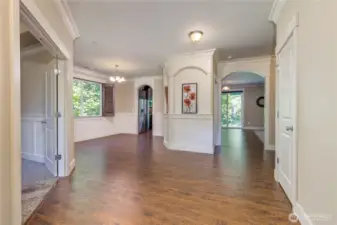 Entry hall with office to the left, dining/kitchen/living areas straight ahead.